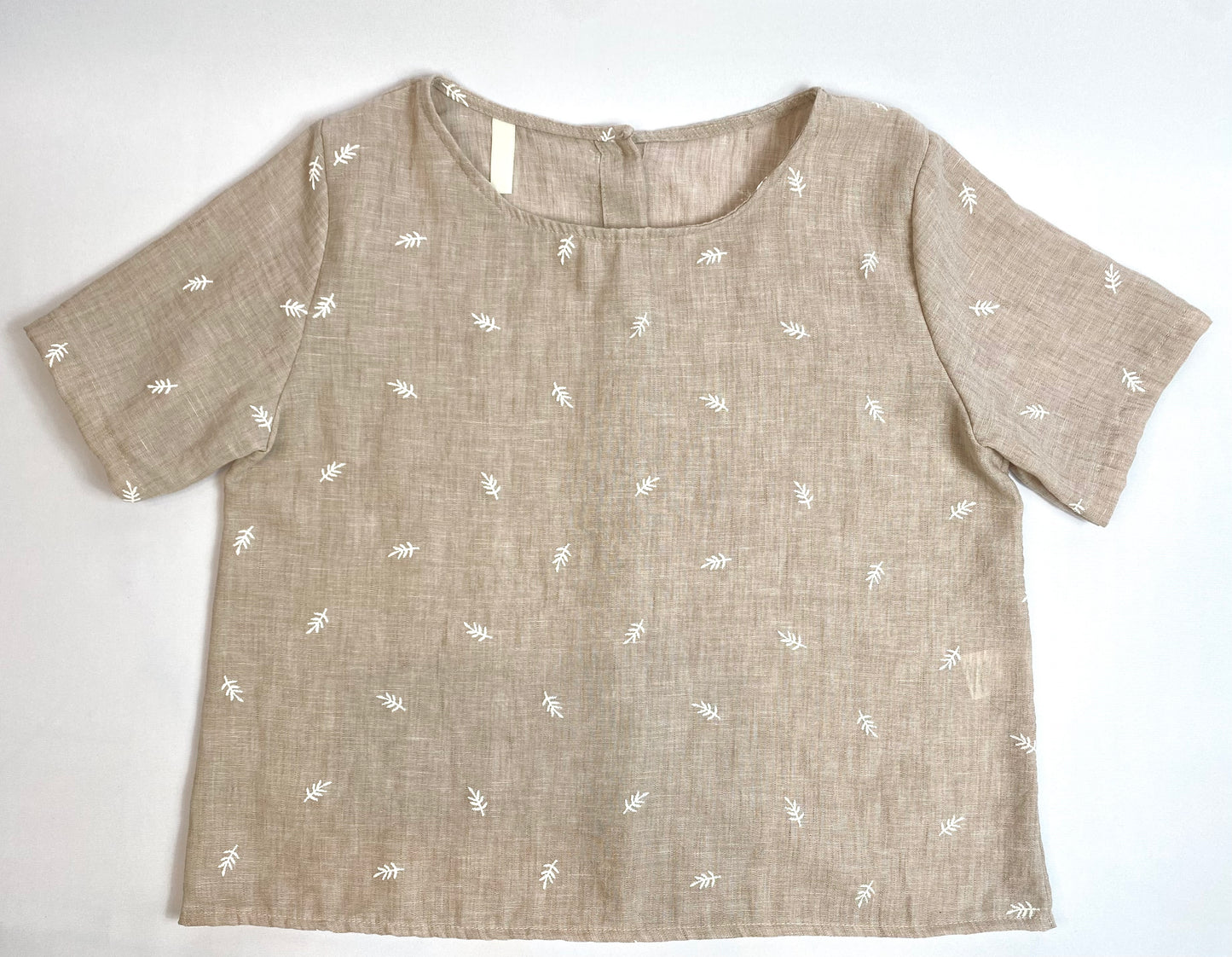 BLUSA CON BOTONES ESPALDA